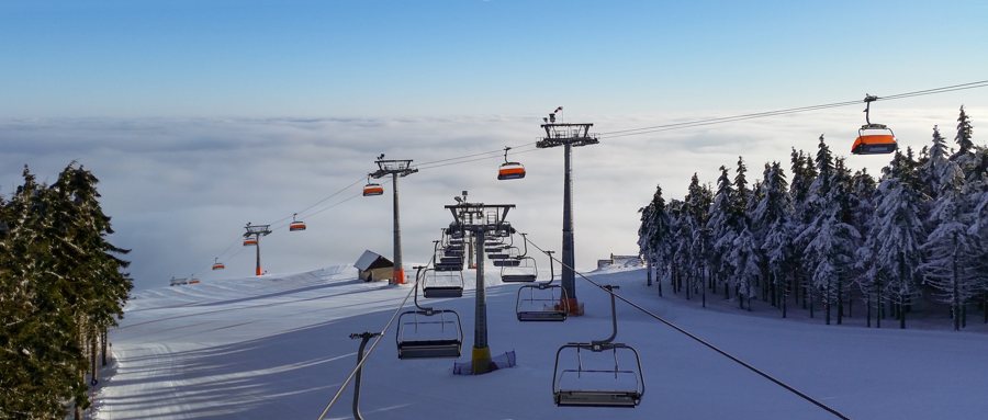 Chairlifts and ski slopes at Zieleniec Ski Arena in winter