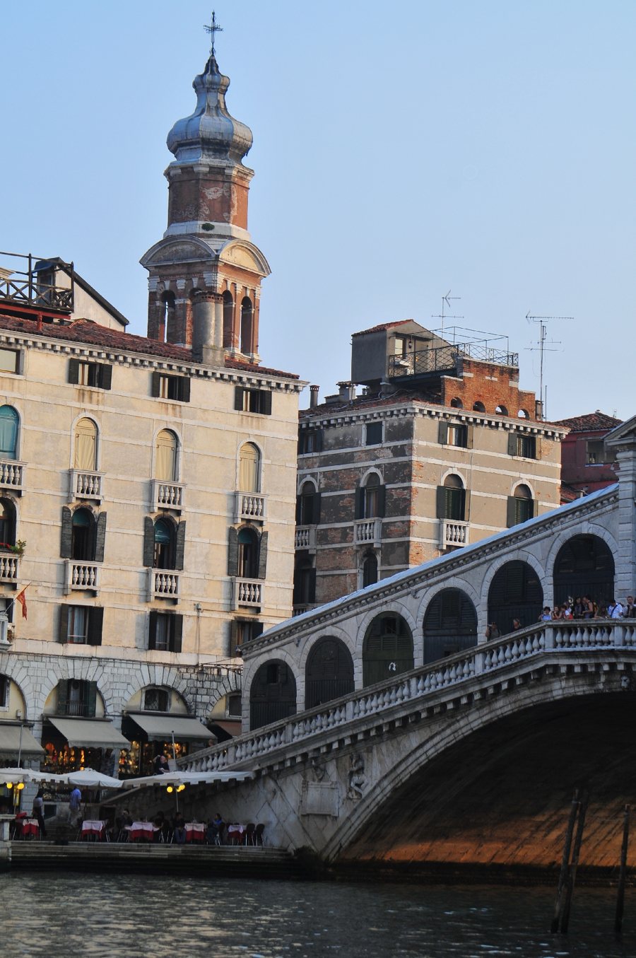 Stone arched bridge over a canal among historic buildings in Venice