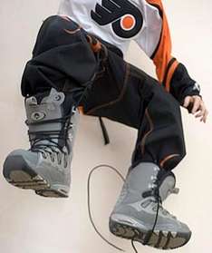 Snowboarder wearing snowboard trousers